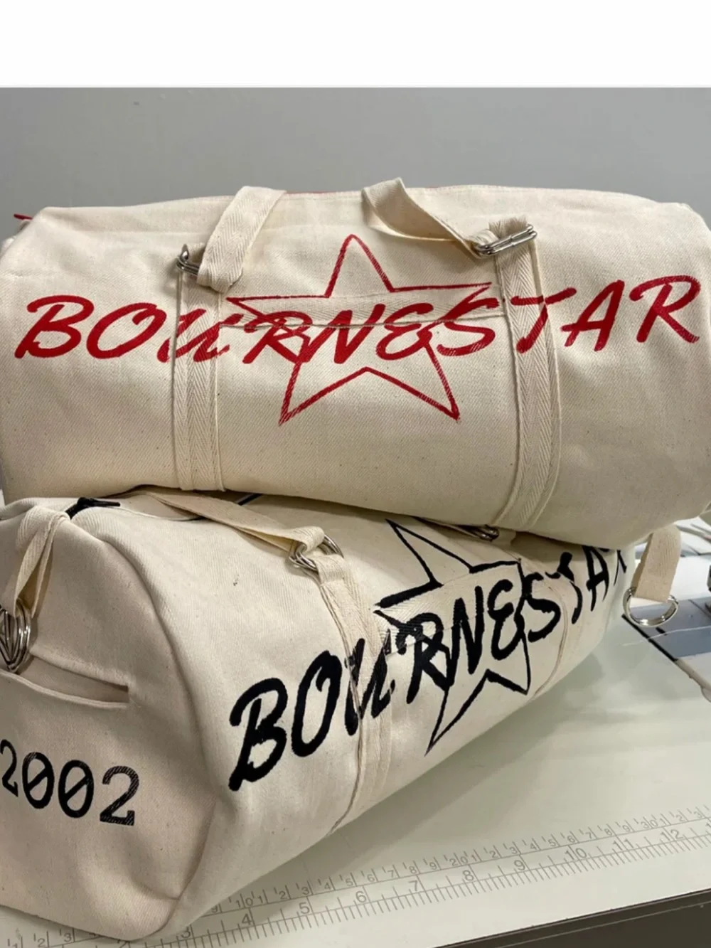 Bourne Star Canvas Duffel Bag in Cream with Red Accents